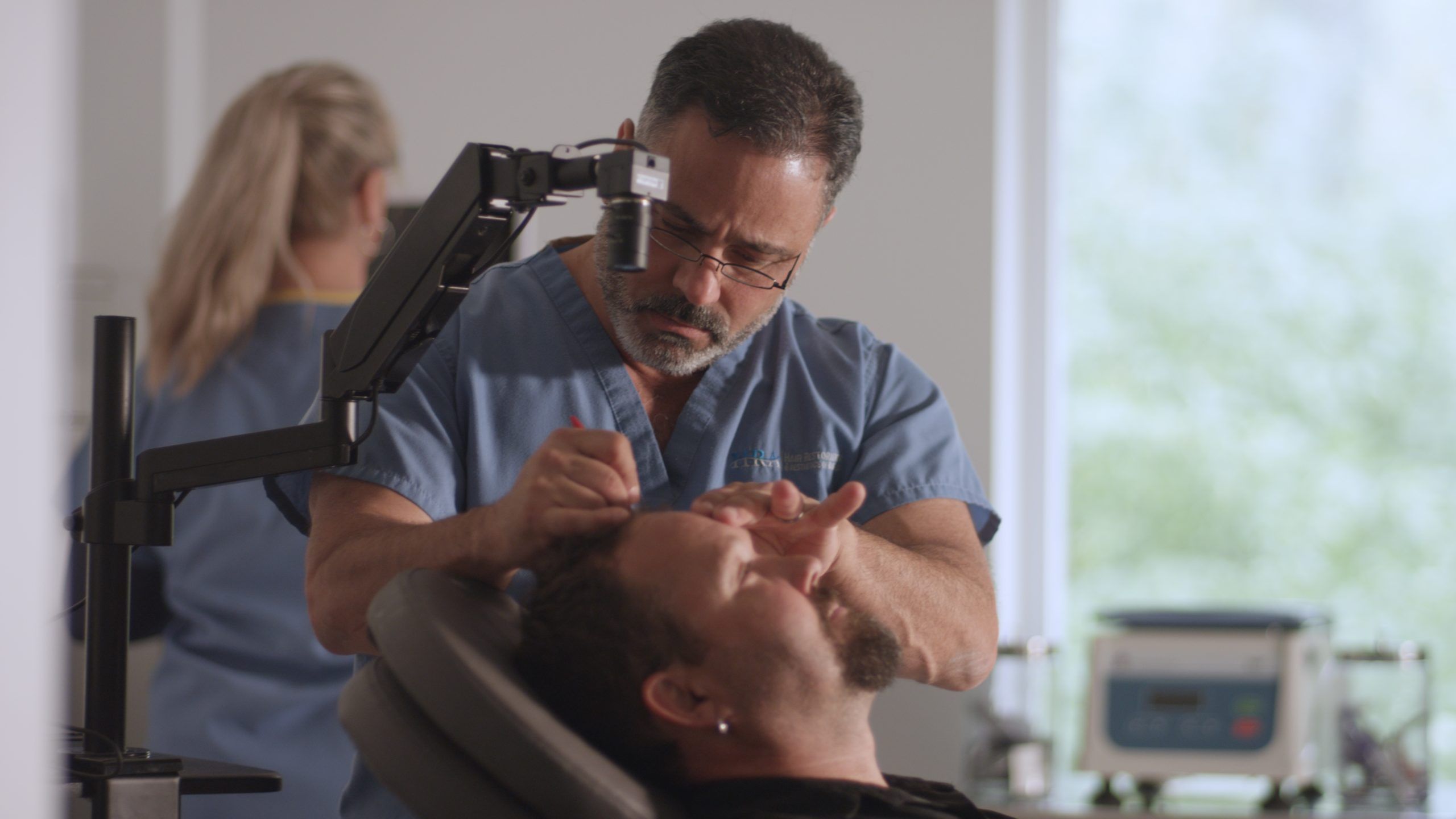 naples florida hair loss specialist performing hair restoration consult