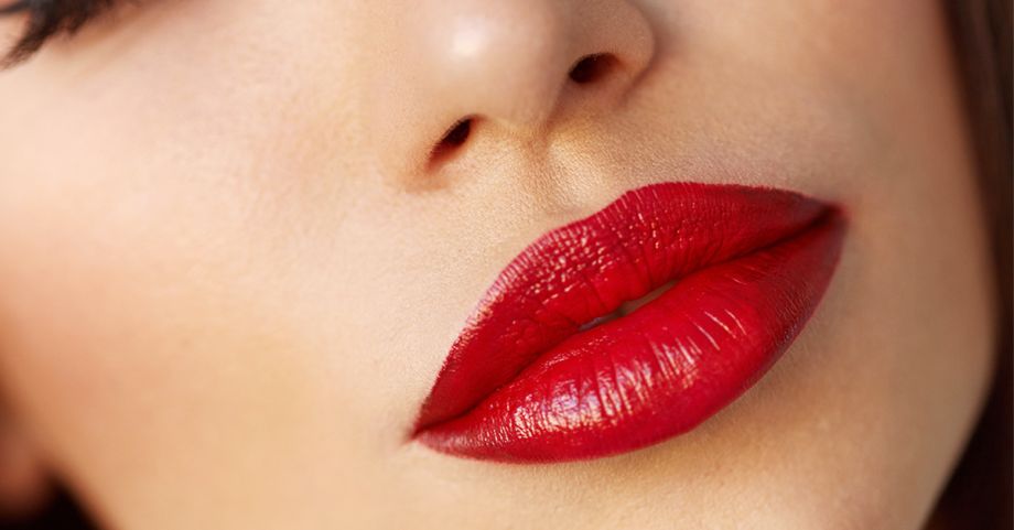 Full juicy lips with red lipstick. Lip enhancement options both invasive and noninvasive via Gardner Plastic Surgery